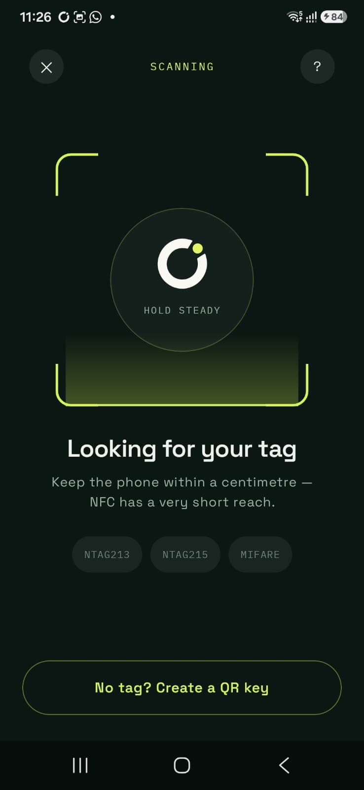 Distly NFC pairing screen looking for a tag, with an option to create a QR key